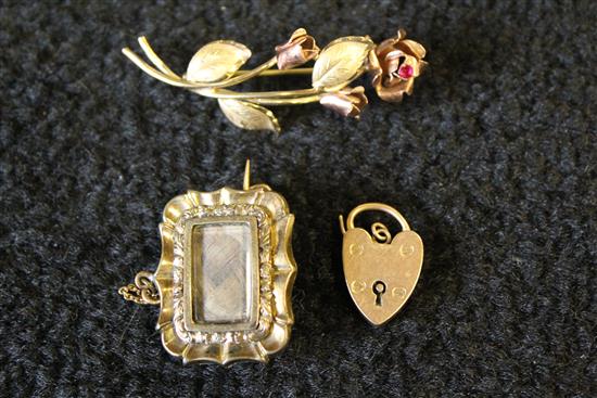 A 9ct gold two colour, gold rose spray brooch, and a 9ct gold padlock,  and mourning brooch